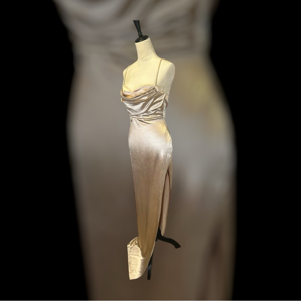 Long elegant gold dress with a split.